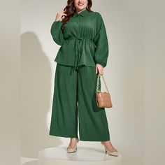 Features: Tied, Buttoned Number Of Pieces: Two-Piece Stretch: No Stretch Material Composition: 100% Polyester Care Instructions: Machine Wash Cold. Tumble Dry Low. Imported Product Measurements: L: Top Length 27.5 In, Bust 50.7 In, Waist 34.3 In, Hip 53 In, Bottom Length 39.2 In Xl: Top Length 28.1 In, Bust 53 In, Waist 36.7 In, Hip 54.6 In, Bottom Length 39.8 In 2xl: Top Length 28.7 In, Bust 55.4 In, Waist 39 In, Hip 56.9 In, Bottom Length 40.4 In 3xl: Top Length 29.3 In, Bust 57.7 In, Waist 41 Top And Wide Leg Pants, Pantalon Large, Button Top, Drawstring Pants, Lantern Sleeves, Fall Wardrobe, Green Fashion, Polished Look, Casual Wardrobe