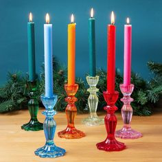 five candles are lined up in different colors