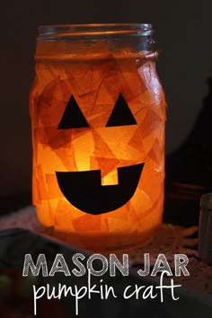 a mason jar with a jack o lantern in it