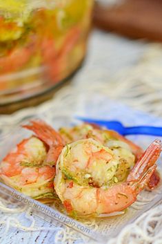 some shrimp in a plastic container on a table