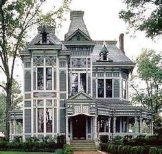 an old victorian style house with many windows