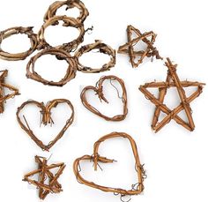 several pieces of wood are arranged in the shape of hearts and star of davids