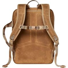 a brown backpack with straps on the front and back pocket, in suede leather