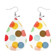 a pair of white leather earrings with multicolored polka dots on the tears