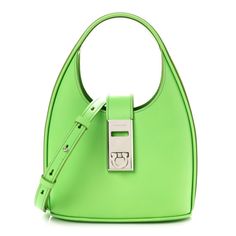 This is an authentic SALVATORE FERRAGAMO Soft Calfskin Mini Gancini Hobo in Lime. This chic hobo is crafted of soft green leather. The bag features a looping hand strap, an optional adjustable shoulder strap and a silver lock embellishment. The bag opens to a green microfiber interior. Hand Strap, Green Leather, Salvatore Ferragamo, Calf Skin, Shoulder Strap, Handbags, Green, Leather, Silver