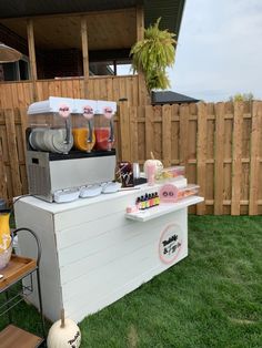 a small ice cream stand in the grass