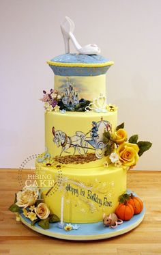 there is a three layer cake decorated with flowers and a shoe on the top tier