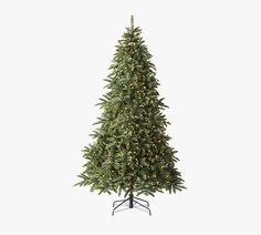 a large christmas tree with lights on it's branches and a stand in front of a white background