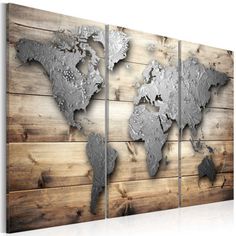 the world map is mounted on a wooden wall with silver paint and wood planks