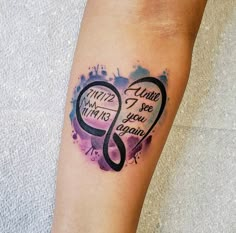 a tattoo on the leg of a woman with two intertwined hearts and words written in black ink