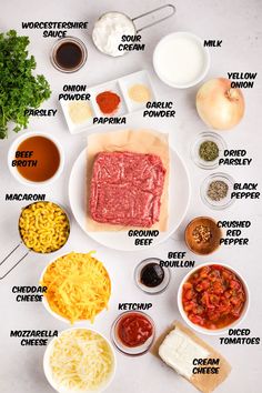 the ingredients for an italian meatloaf recipe laid out on a white counter top