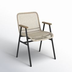 a white chair sitting on top of a white floor next to a wooden frame and black legs