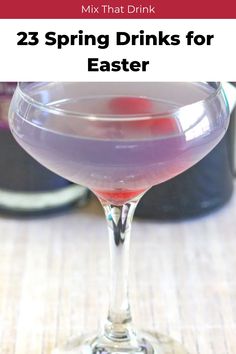 a purple drink in a wine glass with the words, 23 spring drinks for easter