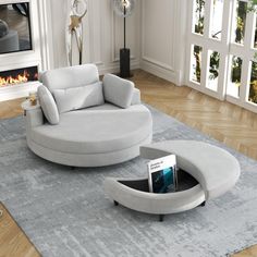 a living room with a circular couch and fireplace