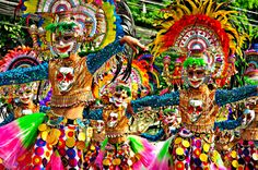 colorfully dressed dancers in costumes and headdresses at the rio feli carnival