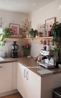 the kitchen is clean and ready to be used as a coffee bar or breakfast bar