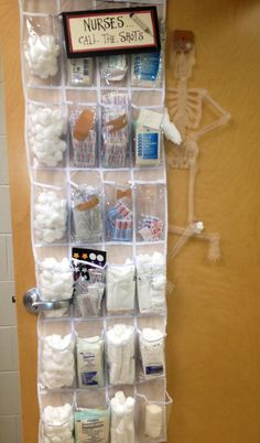 a medical storage rack filled with lots of white items on top of a wooden floor