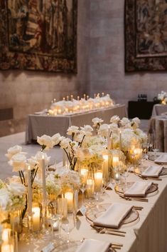 a long table is set with candles and flowers for a wedding reception at the cathedral