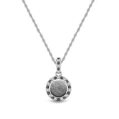 Shine bright with this one-of-a-kind meteorite pendant. The pendant features dazzling diamond accents of black and white. Perfect, Gibeon Meteorite, with it's gorgeously unique pattern, stands strong as the center of attention.The meteorite pendant shows a fantastic Widmansttten pattern. It has been etched with an acid to reveal the characteristic patterns, or Widmansttten figures, of iron meteorites. No two etched meteorites will have the exact same pattern.DETAILS OF THE PENDANT Chain: .50 mm White Gold Pendant Jewelry, White Diamond Jewelry, Meteorite Necklace, Gibeon Meteorite, Meteorite Jewelry, Meteorite Pendant, Iron Meteorite, Halo Necklace, White Gold Jewelry