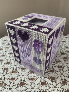 a purple and white box sitting on top of a table