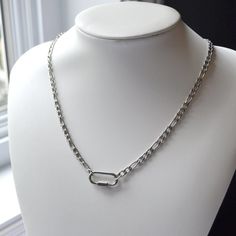 Durable and stylish, this Silver Carabiner Pendant Necklace is the ultimate accessory for those on the go. With its high-quality design and water-safe properties, it makes for the perfect gift for any jewelry lover. 💎Free shipping on all orders💎Waterproof and non-tarnish💎Packaging that is ready to offer as a gift💎Customizable chain length Our silver carabiner pendant necklace, a practical necklace It's versatile design allows you to attach your favorite charms on the carabiner, or use it to Carabiner Necklace, Figaro Chain Necklace, Chain For Men, Necklace Mens, Lock Necklace, Figaro Chains, Figaro Chain, Silver Chain Necklace, Chains For Men