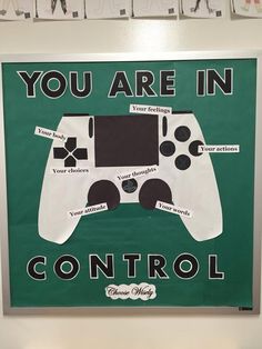 there is a sign that says, you are in control with the game controller on it