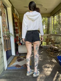 "I wish I could pull these off! Best faded black 90's high waisted black denim shorts. Frayed hem and cheeky bottom. Waist: 24\" Hips: 34\" Rise: 12\" Model is 5'7\" and 115 lbs with measurements of 30x23x33. Buy with confidence as all outside photos are taken in natural lighting" All Black Shorts Outfit, Outside Photos, Black Denim Vest, 115 Lbs, Black Jean Shorts, Cutoff Shorts, Black High Waist, Natural Lighting, Leather Vest