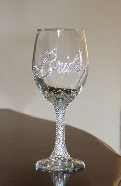 a wine glass with the word bride written on it