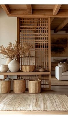 a living room filled with lots of furniture and baskets on top of a wooden shelf