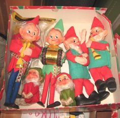 a box filled with christmas gnome figurines sitting on top of a table