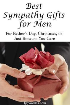 a man holding a red gift box with the words best sympathy gifts for men