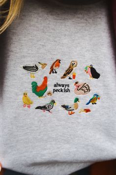 Birds & snacks ❤️🦆 ☺ 50% cotton & 50% polyester blend, with a cosy, fleece lining inside. ✐ Dreamed up, hand drawn, designed & embroidered in the UK. ✿ Hand wash if possible. Or machine wash, inside out, at 30°c. ♥ Everything is uni-sex sizing, yay! Please take a look at our size guide for more details (it's just next to the product title). ☻ Sade is a UK size 8 & wears a size L navy sweatshirt ☻ Luena is a UK size 14 & wears a size XL pastel green sweatshirt ☻ Amelia is a UK size 12 & wears a Embroided Sweatshirt, Happy Embroidery, Cool Sweatshirts, W Pictures, Gift Guide Design, Types Of Aesthetics, Cool Dude, Clothing Wishlist, Navy Sweatshirt