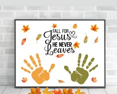 fall for jesus he never leaves with hand prints and autumn leaves on the floor next to it