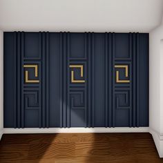 an empty room with blue walls and gold trimmings on the doors, in front of a wooden floor