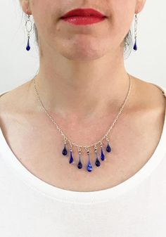 Sustainable fashion - sun-melted cobalt blue glass and recycled silver jewelry Nickel-free Glass Drop Jewelry, Elegant Glass Drop Jewelry, Elegant Drop Glass Jewelry, Elegant Drop-shaped Glass Jewelry, Party Drop Necklace With Adjustable Chain, Silver Adjustable Teardrop Crystal Necklace, Silver Adjustable Teardrop Crystal Necklaces, Nickel-free Drop Sterling Silver Necklace, Teardrop Adjustable Chain Necklace For Party