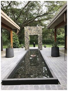 an outdoor water feature in the middle of a patio