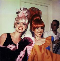 two women with red hair standing next to each other