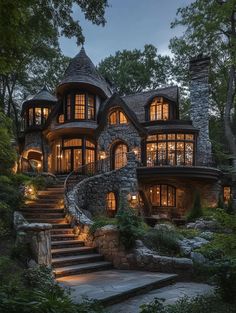 a large stone house with stairs leading up to it