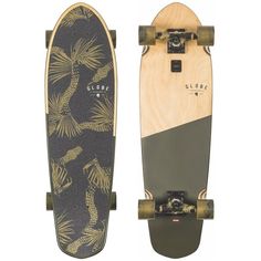 a skateboard with palm trees on it next to another skateboard that is black and gold