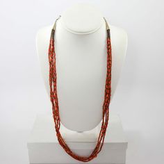 1980s Santo Domingo Five Strand Bead Necklace with Alternating Mediterranean Coral and Pen Shell Heishi Beads and a Sterling Silver Clasp and Chain. Number of Strands: 5Necklace Length: 30” Traditional Multi-strand Polished Beaded Necklaces, Traditional Long Necklace With Beaded Chain And Round Beads, Traditional Long Necklace With Round Beaded Chain, Traditional Long Necklace With Beaded Chain, Orange Multi-strand Hand-strung Jewelry, Traditional Multi-strand Polished Bead Necklaces, Orange Hand-strung Multi-strand Jewelry, Artisan Multi-strand Beaded Chain Jewelry, Traditional Multi-strand Necklaces With Polished Beads