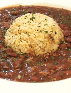 a white bowl filled with beans and rice