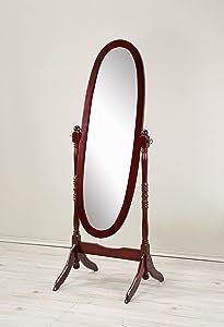 an oval mirror is on a stand in front of a white wall and hardwood floor