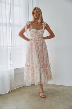 You'll love how you look in the Celine Floral Tie Strap Bustier Maxi Dress! This stunning dress features a feminine floral print, adjustable bow straps, a bustier style top, and a ruffle hem. Pair with a simple heel to complete the look! Details 100% Polyester Built in padding Tie straps Silicone grips Smocked back Back zipper Hand wash cold / Dry flat Floral Maxi Tie-strap Dress, Bridal Tea Party Outfit, Tea Party Bridal Shower Ideas Outfit, Hoco Fits, Garden Party Dresses, Mila Dress, Wedding Guest Outfit Inspiration, Hoco 2024, Dress With Tie Straps