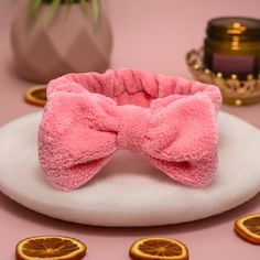 "Keep your hair off your face with our super soft face wash headband. Perfect for keeping your hair back while washing your face, wearing a face mask, or applying your makeup. Made of plush, soft fleece, it will not damage your hair. No need to worry about sizing, it's super stretchy, and one size fits all. *Featuring a large pink bow, keep it cute and feel pampered. Throw a spa party - your friends will love these matching beauty accessories #wecute. Treat yourself and pair it with our reusable Face Wash Headband, Spa Days, Eyebrow Razor, Washing Your Face, Soft Face, Makeup Remover Pads, Facial Hair Removal, Spa Party, Wash Your Face