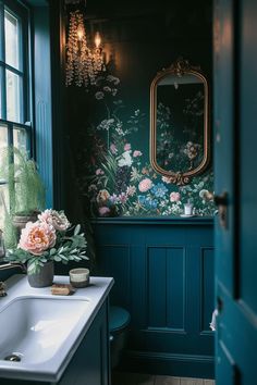 a bathroom with blue walls and floral wallpaper on the walls, along with a white sink