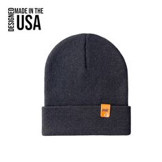 Introducing the HAAKWEAR Cuffed Beanie, the perfect accessory for men, women, and teens! This beanie is proudly made in the USA, crafted to cater to your sense of individuality. Stay warm and stylish with its modern design, while the cuffed feature adds a touch of versatility to adapt to your personal style. Made with the utmost attention to detail, this beanie provides warmth and coziness whether you're hitting the slopes or strolling through the city.   Features:One Size Fits MostUnisex DesignVersatile StyleBreathable100% Acrylic100% PU Artificial Vegan Leather Logo Color: Charcoal Black Country of Origin: United States (USA) Cuffed Beanie, Stylish Hats, Quality Hats, Head Shapes, Charcoal Black, Skull Cap Beanie, Leather Logo, Logo Color, Skull Cap