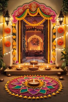 a decorated stage with candles and flowers on the floor for diwaling or decorating