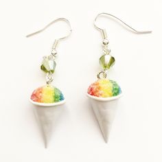 These earrings feature a pair of handmade snow cones made from polymer clay. Each charm measures about 2 cm tall and are attached to a sterling silver hook. The entire earrings length is 5 cm. SKU 1501 Geode Jewelry, Weird Jewelry, Funny Earrings, Snow Cone, Quirky Earrings, Food Earrings, Look Retro, Funky Earrings, Snow Cones