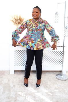 This versatile Ankara top allows you to express your unique sense of style while celebrating the rich heritage of African prints Multicolor Printed Party Shirt, Chic Blue Top With Abstract Print, Fitted Abstract Print Top For Party, Multicolor Long Sleeve Top With Abstract Print, Chic Multicolor Abstract Print Blouse, Multicolor Floral Print Long Sleeve Tops, Chic Floral Print Fitted Top, Chic Patterned Blouse With Vibrant Print, Chic Patterned Tops With Abstract Print