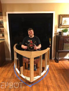 a man sitting on top of a wooden stair case